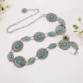 Close-up detail of vintage bohemian turquoise flower metal waist chain dress accessory. - Green Turquoise