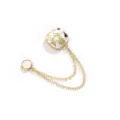 Gold-tone magnetic clothing clasp with white enamel pattern and double chain accessory. - Drawing White
