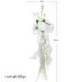 White artificial wedding chair back flower decoration with ribbons for party and event decor. - White
