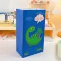 Sacchetto regalo in carta kraft blu con simpatico dinosauro per feste di compleanno e caramelle. - Dinosauro YC-04