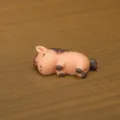 Miniature resin sleeping horse figurine detail view showing compact size and weight. - Lying Little Pony