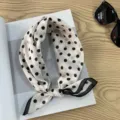 Detail shot of vintage Japanese style polka dot cotton head scarf with chic black trim. - Polka Dot Edge