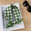 Detailed close-up view of green and white checkered cotton scarf showing soft fabric texture. - Green White Plaid