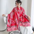 Detail shot of the red paisley pattern imitation cashmere shawl for women autumn winter wear. - 50_Peach Pink Paisley Zebra - Red