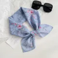 Chic blue floral print silk scarf detail, exquisite botanical pattern design for versatile styling. - Purple Floral Leaves / Purple