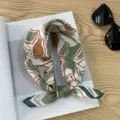 Close-up detail view of retro print square scarf, stylish cotton neckerchief texture. - Picture #10