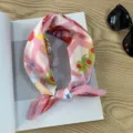 Detailed view of pink patterned cotton bandana scarf, perfect for neckerchief or hair wrap styling. - Picture #13