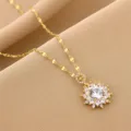 Cadena de clavícula dorada elegante con colgante de flor de circonita brillante, joya. - Dorado