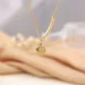 Gold titanium steel smiley face pendant necklace, fashion clavicle chain jewelry item. - Gold