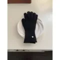Women's warm black knit gloves with elegant metal wrist tag, cozy winter essential. - Black Glove