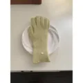 Light green knitted gloves for women, warm winter five-finger gloves with ribbed cuffs and metal charm. - Mustard Yellow Gloves