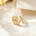 Gold titanium steel wave ring, adjustable open band for women, minimalist fashion. - Wave Style / Gold