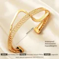Goldener Edelstahl Armreif mit Federdesign, wasserdicht und hypoallergen für Damen. - Gold Z-förmige Spirale