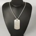 Detailed view of the stainless steel letter G dog tag pendant necklace, hip hop street style. - Letter G