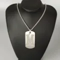 Stainless steel letter M pendant necklace detail view, fashion hip hop street style jewelry item. - Letter M