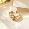 Minimalist gold metal open ring with elegant flowing design, adjustable size, fashion accessory. - Gold Water Drop