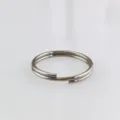 Close-up detail shot of stainless steel double split ring, durable DIY jewelry connecting loop. - Double Split Rings (0.5mm Wire, 5mm Diameter)