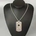 Stainless steel letter R pendant necklace detail view, hip hop street style jewelry close up. - Letter R