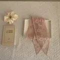 Detailed shot of pink embroidered lace ribbon, delicate floral pattern on sheer mesh fabric. - 6# Peach Pink