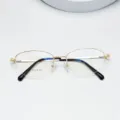 Oval metal half-rim optical glasses frame, women's lightweight prescription eyewear detail. - Bright Gold
