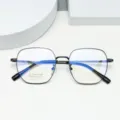 Detail view of large polygonal titanium optical glasses frame with slim black rim. - Bright Black