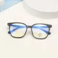 Detailed close-up of the black square optical glasses frame featuring blue light blocking lenses. - Bright Black