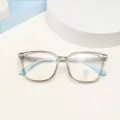 Detailed view of fashionable square anti-blue light glasses with TR90 grey frame and blue temples. - Transparent Gray