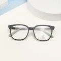 Detailed shot of anti-blue light TR90 optical glasses with stylish black square frames. - Matte Black
