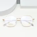 Primer plano de la montura de gafas ópticas de metal multilateral en oro rosa con titanio. - Rosa oro