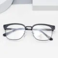 Closeup of stylish black half-frame anti-blue light glasses with UV400 lens protection. - Matte Black