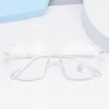 Transparent anti-blue light glasses frame detail, stylish multi-sided optical eyewear design. - Clear White