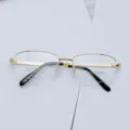 Close-up detail of luxury gold-plated men business semi-rimless eyeglasses frame 3027. - Bright Gold