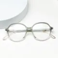 Detail view of lightweight TR90 optical glasses frame with gradient grey and pink rim design. - Gradient Green