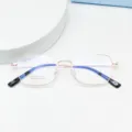 Detailed view of lightweight beta titanium optical eyeglass frame with square metal design. - Bright Gold