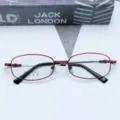Close-up of red and black metal optical glasses frame detail with memory alloy material. - Red / Plain