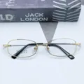 Close-up of business memory titanium eyeglasses frame, elegant gold metal rim with black temples. - Gold / Plain