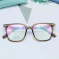 Close-up of trendy TR90 square optical glasses frame in brown, lightweight and vintage design. - Tea Transparent