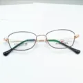 Detailed view of metal eyeglass frames with clear demo lenses, lightweight design for daily wear. - Black Rose