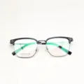 Detailed view of semi-rimless glasses frame with black browline and green temples closeup view. - Black and Gray