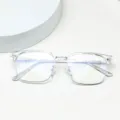 Close-up detail of transparent anti-blue light glasses frame, clear modern optical eyewear. - Clear White