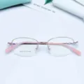 Detailed view of the elegant rose gold semi-rimless optical glasses frame with sleek pink temples. - Pink