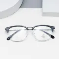 Detailed closeup view of stylish half-rim optical eyeglasses with clear anti-blue lenses. - Black Silver