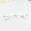Detailed close up shot of rose gold half rim optical glasses frame with clear demo lenses. - Rose Gold