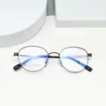 Classic round beta-titanium eyeglasses frame detail view, minimalist thin black rim. - Bright Black