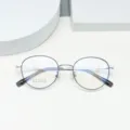 Detail view of round beta-titanium eyeglasses frame, lightweight optical glasses 50-19-143. - Black Silver