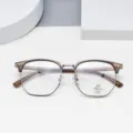 Close-up detail view of stylish multi-sided anti-blue light glasses frame with clear lenses. - Brown