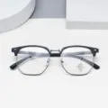 Close-up detail view of stylish half-frame anti-blue light glasses featuring clear lenses. - Matte Black