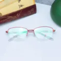 Montatura per occhiali da vista semicerchiata in metallo rosso, elegante e versatile. - Rosso