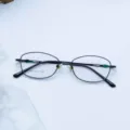 Metal full frame eyeglasses detailed view showing lens model and size specifications - Bright Black / Plain