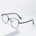 Close-up detail of vintage black metal polygon glasses frame showing delicate temple and lens. - Bright Black / Anti blue light